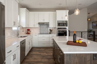 white-kitchen-quartz-counters-and-island-after-remodel