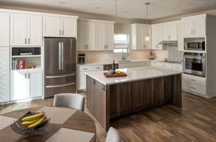 white-kitchen-with-dark-wood-island-after-remodel