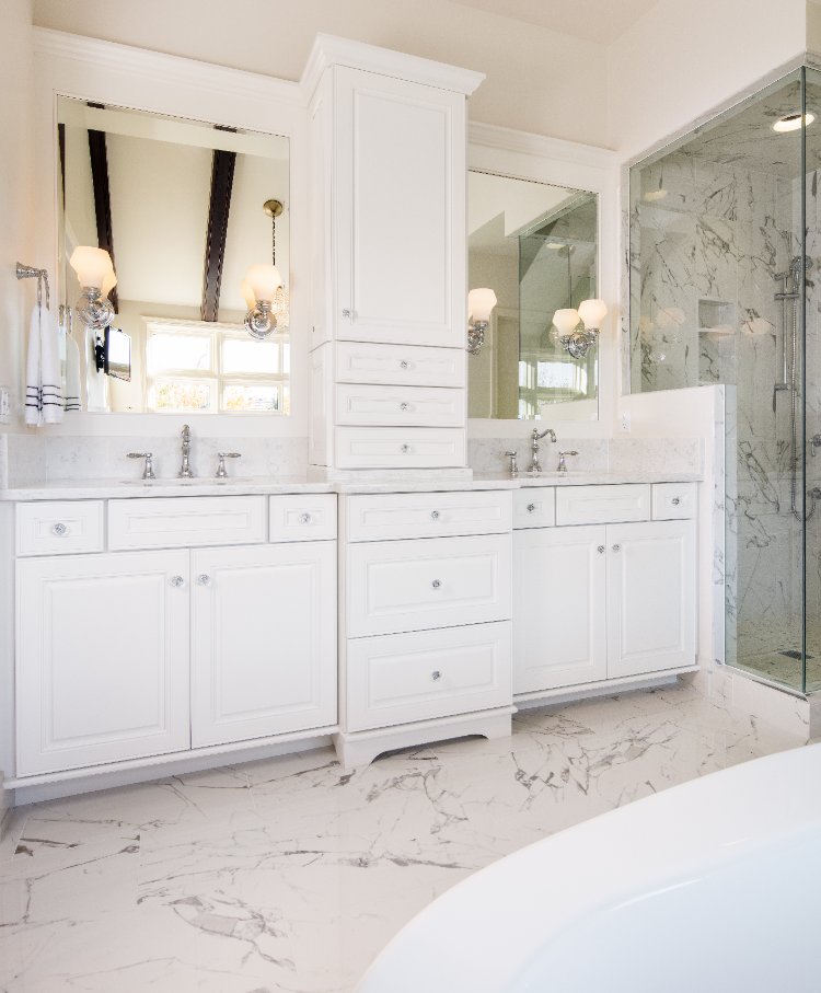 Master bathroom remodel by HC Remodel & Design in Omaha, NE featuring a custom double vanity with white cabinetry and marble cou-optimized