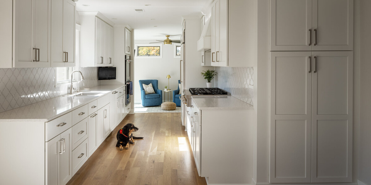 galley-kitchen-hallway-view-with-wood-flooring-omaha-ne-1200x600