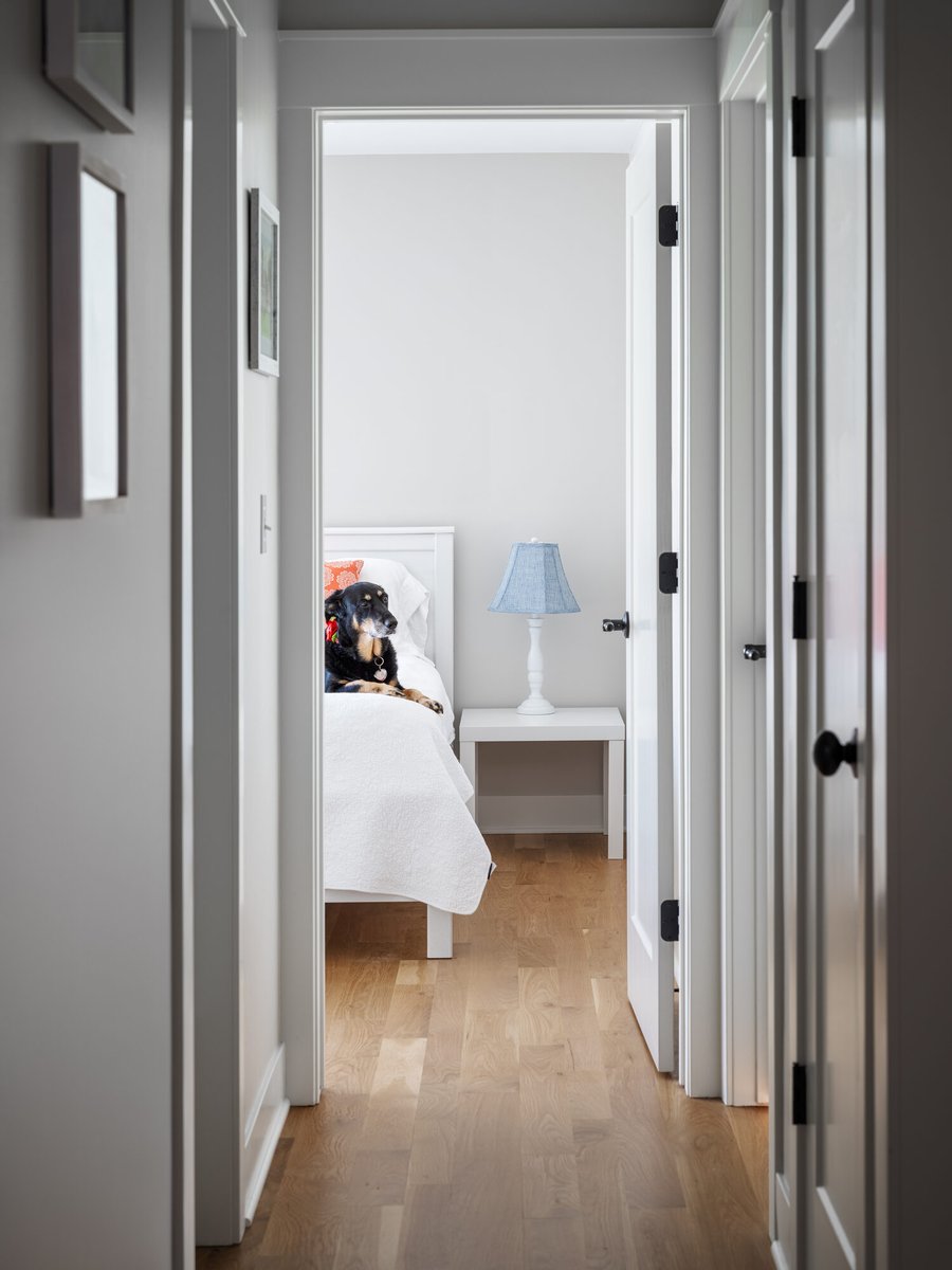 hallway-view-into-renovated-bathroom-with-wood-flooring-omaha-ne-optimized