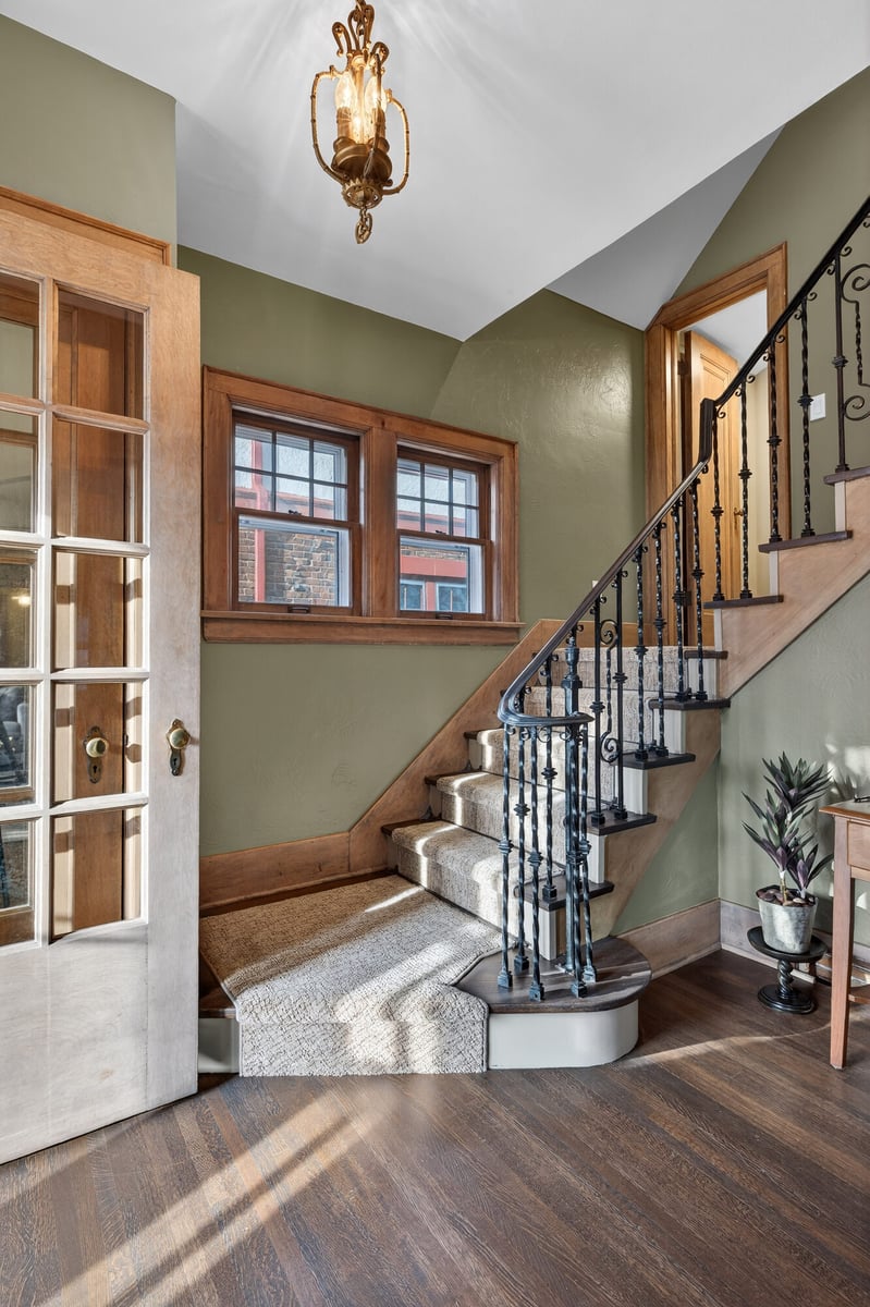 staircase-hallway-with-antique-sconce-omaha-ne-optimized