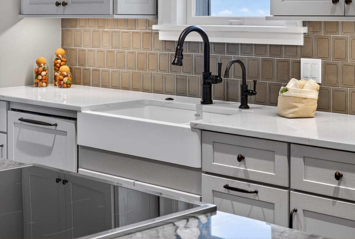 farmhouse-sink-with-tile-backsplash-and-brass-fixtures-omaha-ne-optimized