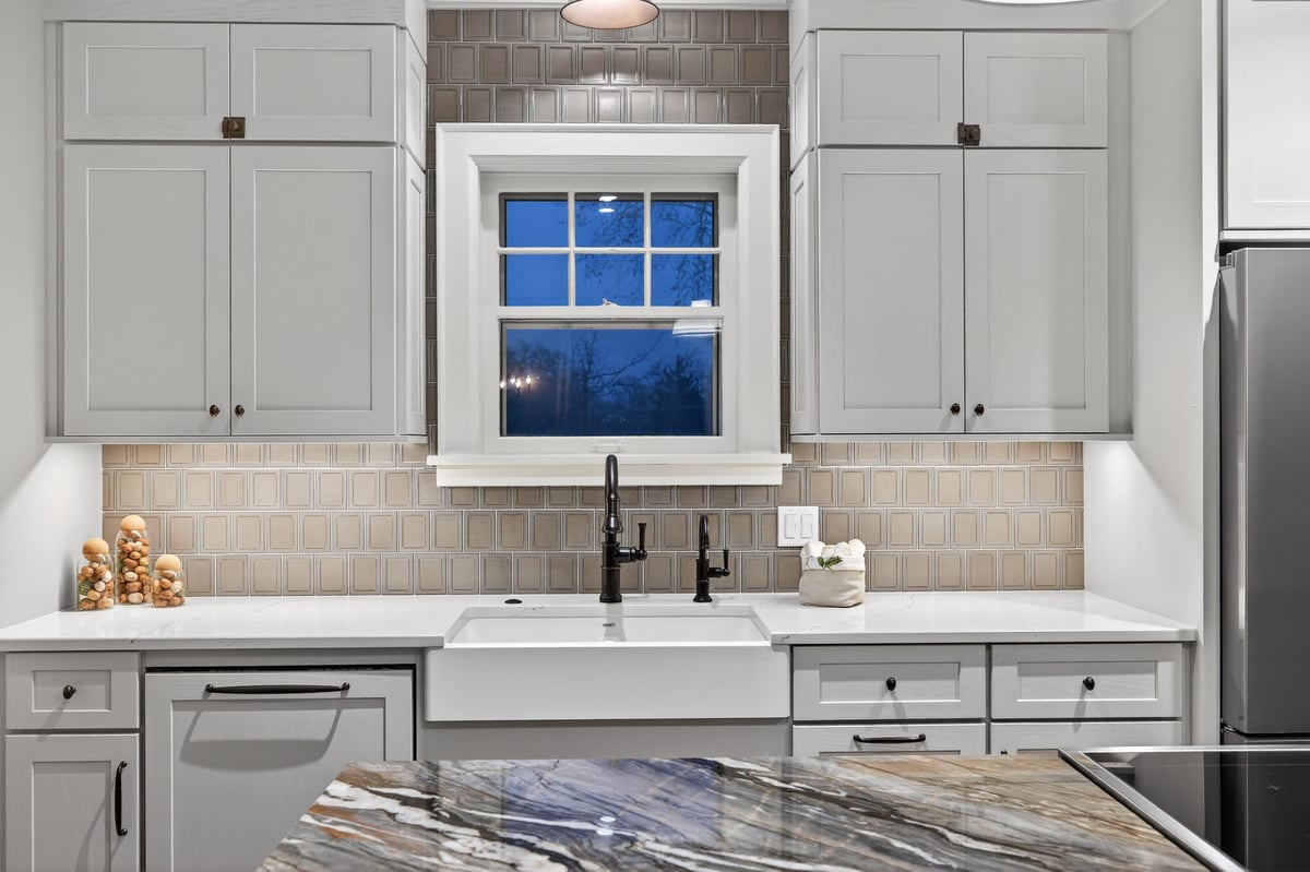 kitchen-sink-window-view-with-tile-backsplash-omaha-ne-optimized