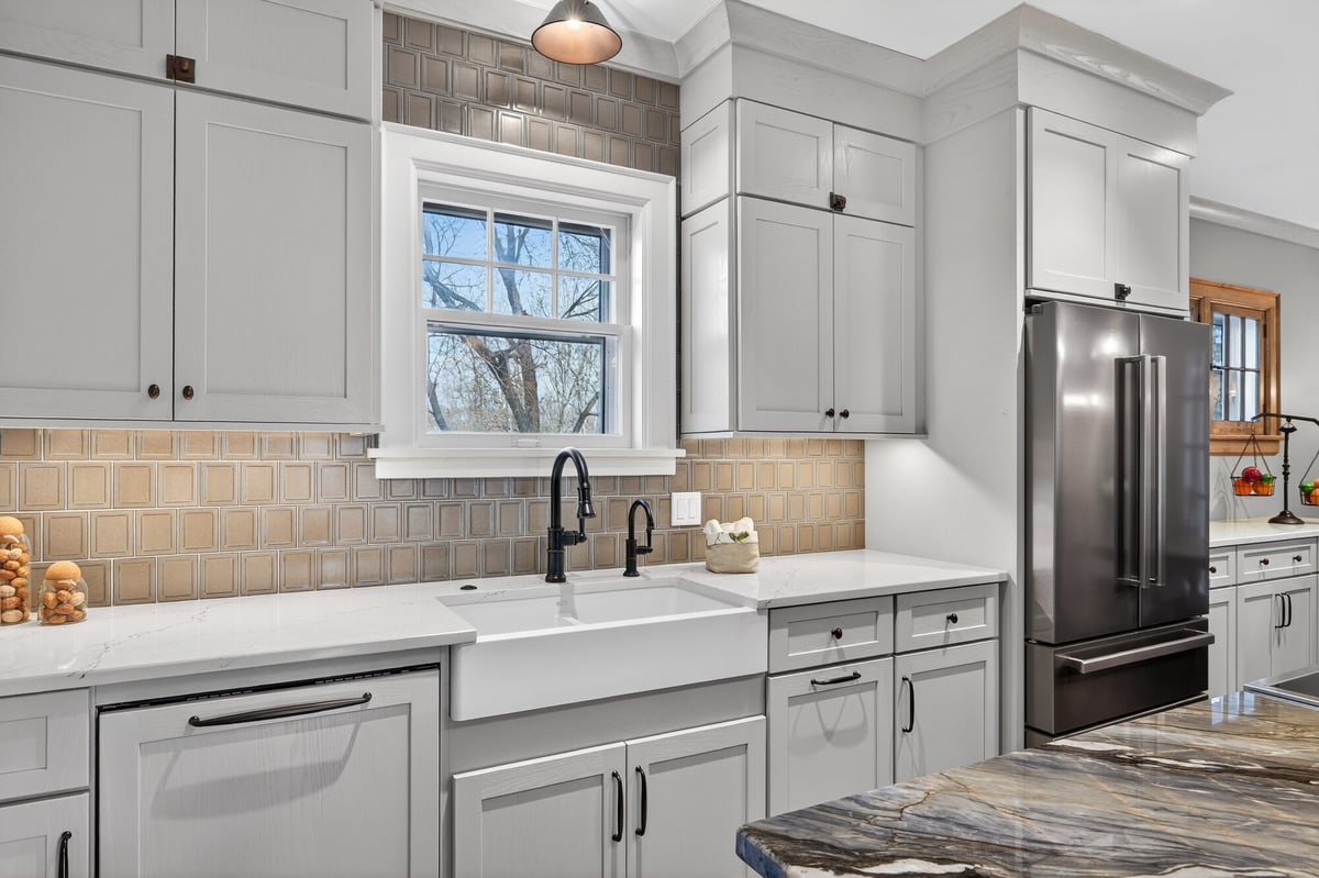 kitchen-sink-with-tile-backsplash-and-stone-counters-omaha-ne-optimized