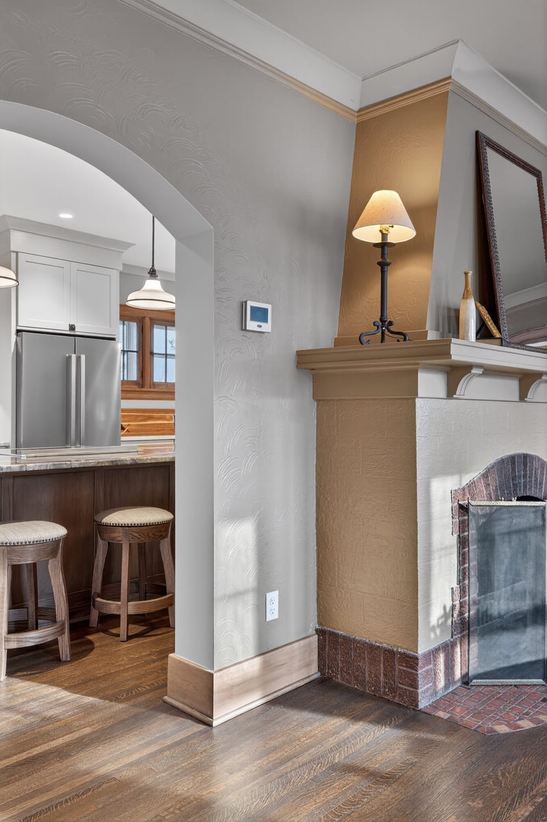 kitchen-nook-with-fireplace-and-bar-stools-omaha-ne-optimized