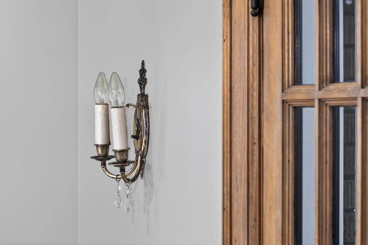 antique-sconce-near-glass-paned-door-omaha-ne-optimized