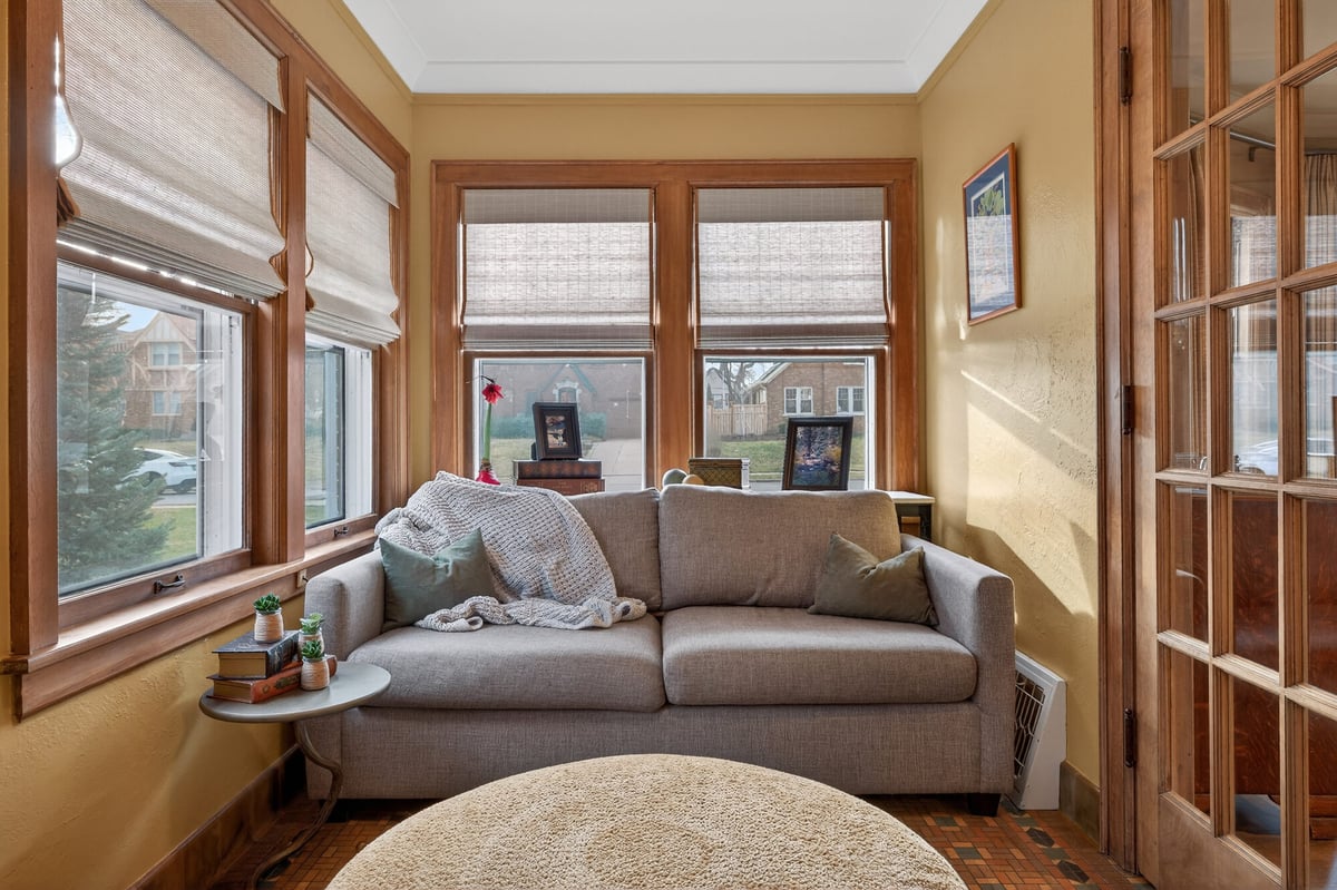 sunroom-with-windows-and-neutral-sofa-omaha-ne-optimized