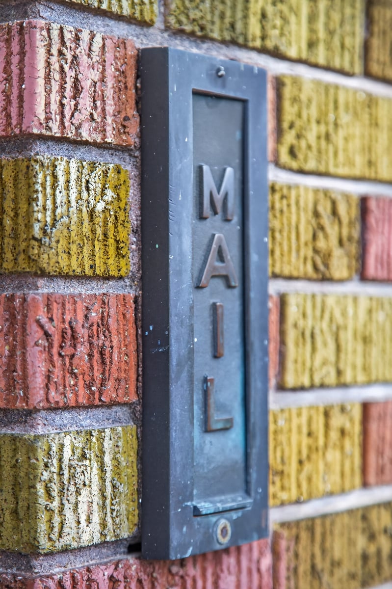 vintage-mailbox-detail-on-tiled-wall-omaha-ne-optimized