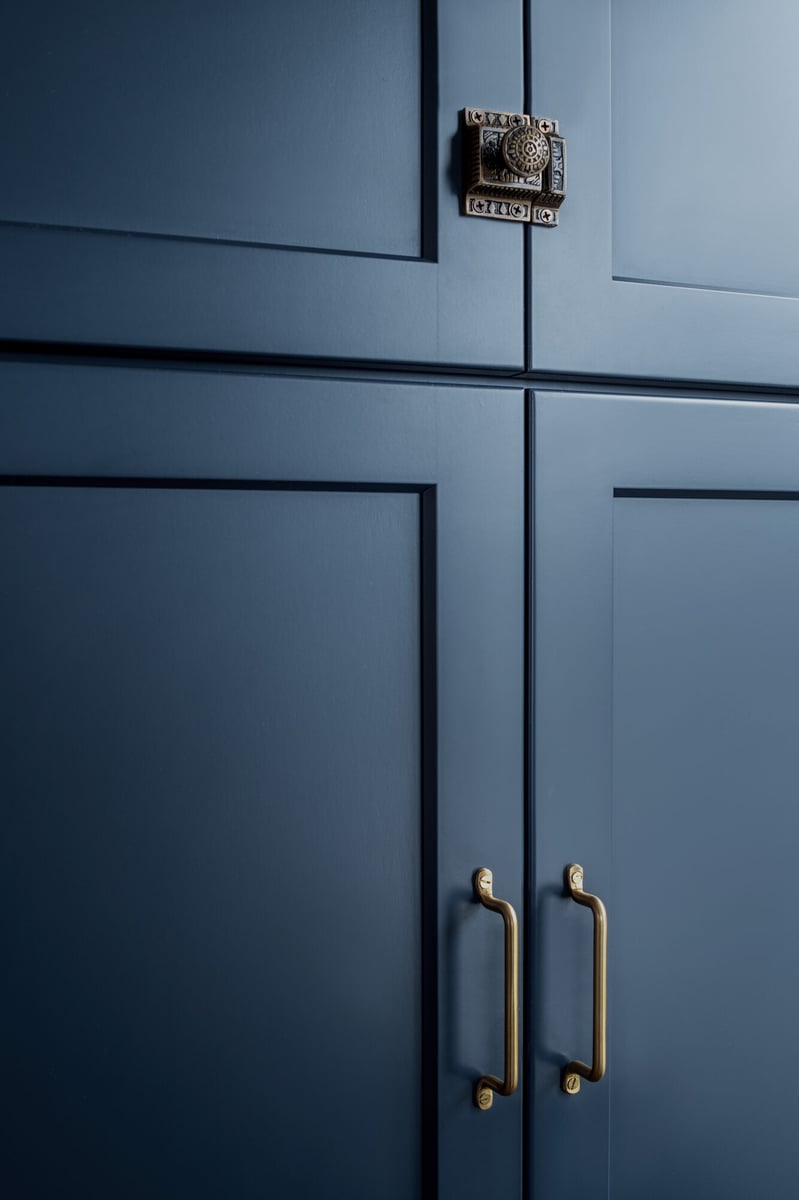navy-cabinetry-with-brass-hardware-detail-omaha-ne-optimized