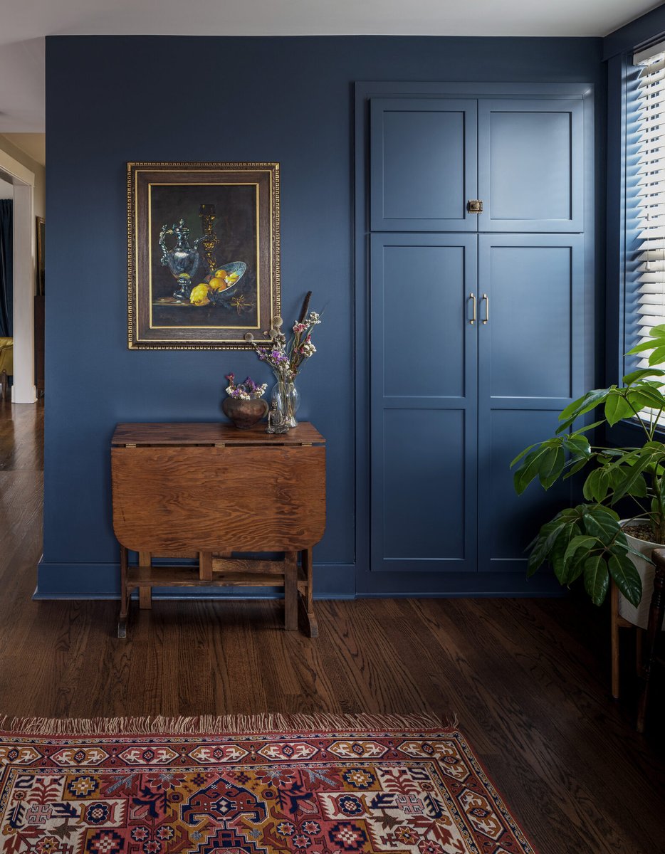 navy-hallway-with-antique-console-table-omaha-ne-optimized
