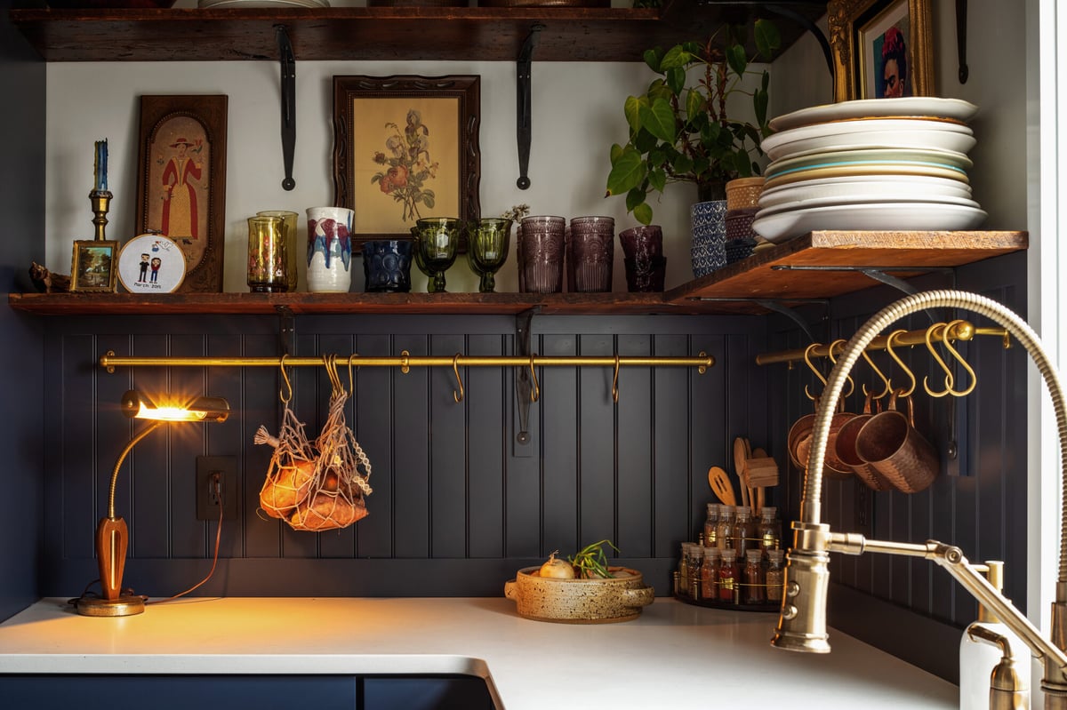 navy-kitchen-open-shelving-with-brass-accents-omaha-ne-optimized