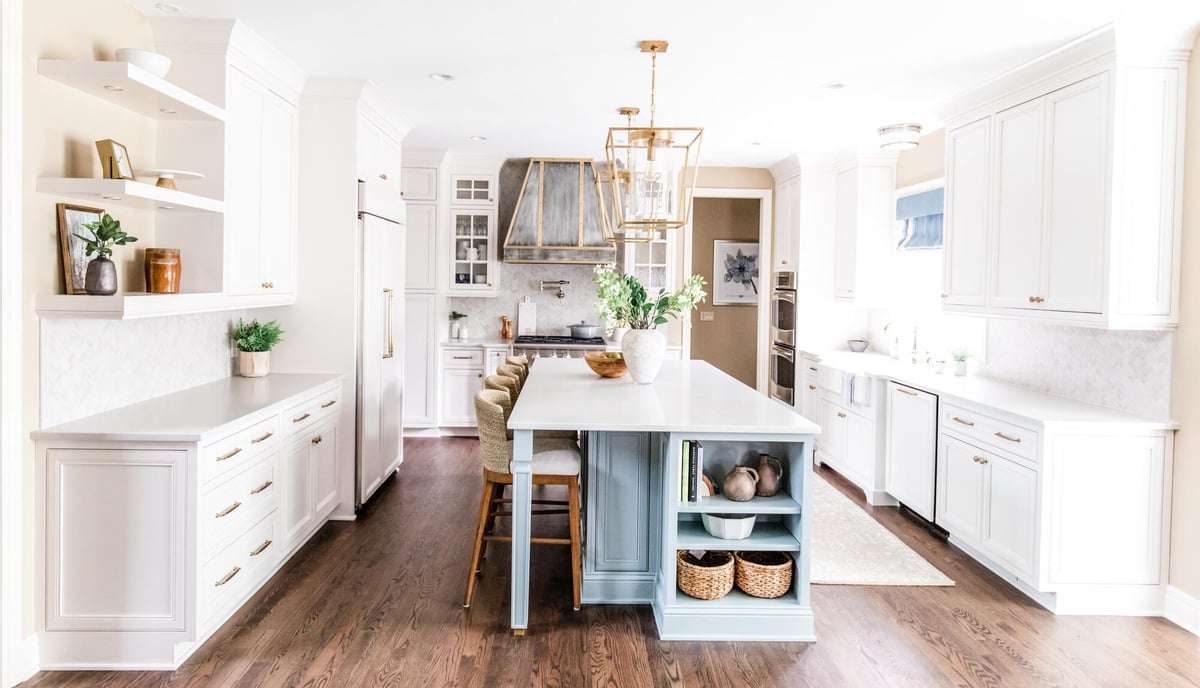 white-kitchen-with-blue-island-and-dining-area-omaha-ne-optimized