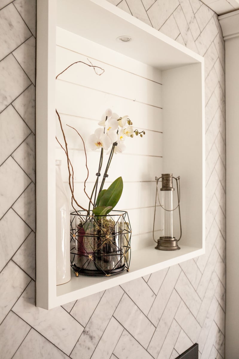 wall-niche-with-herringbone-tile-and-orchid-omaha-ne-optimized