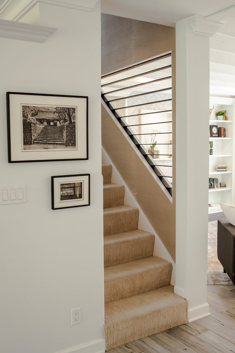 staircase-with-carpet-runner-and-gallery-wall-omaha-ne-optimized
