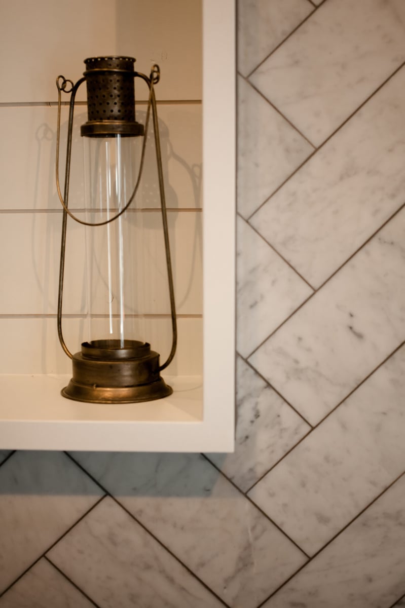 lantern-decor-on-herringbone-tile-ledge-omaha-ne-optimized