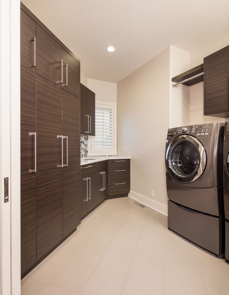 laundry-room-with-dark-wood-cabinetry-omaha-ne-optimized