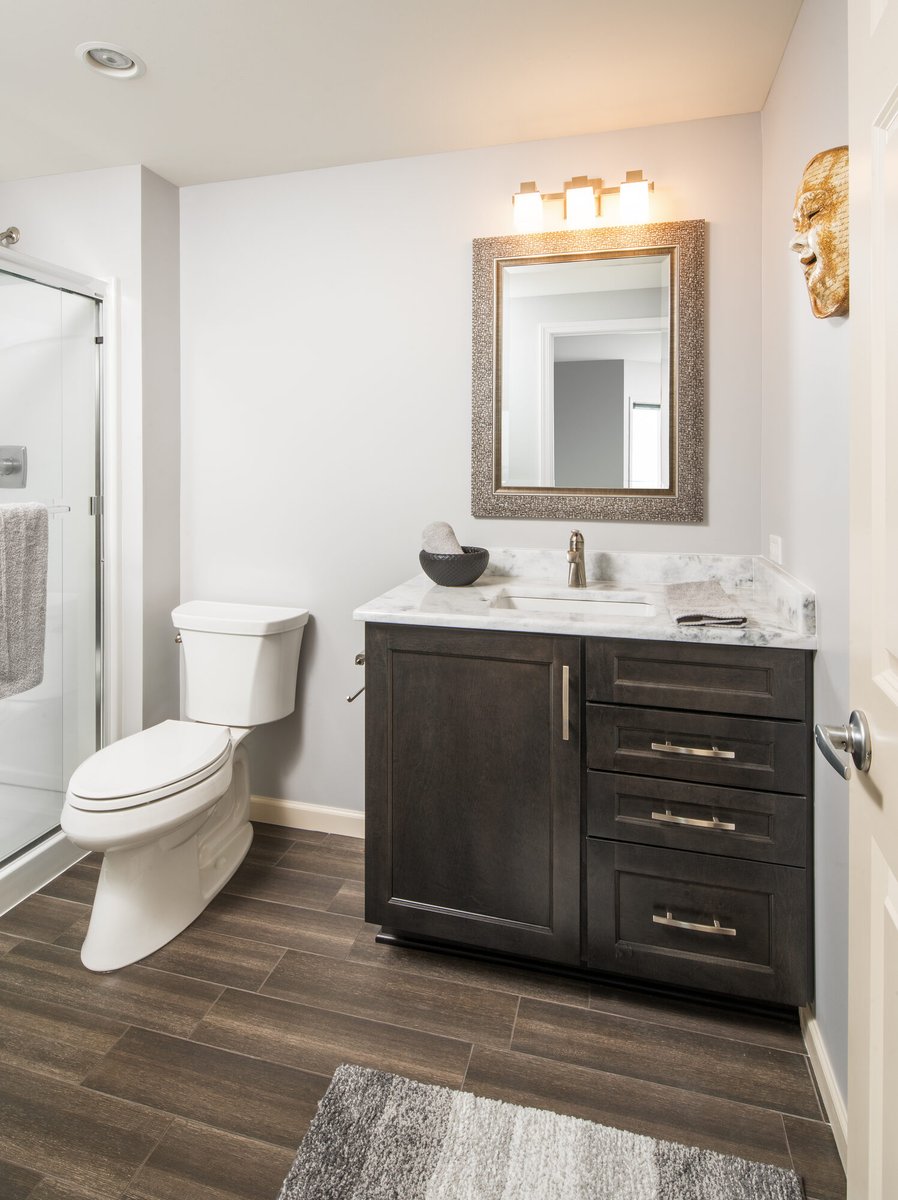 basement-bathroom-with-dark-vanity-and-walk-in-shower-council-bluffs-ia-optimized