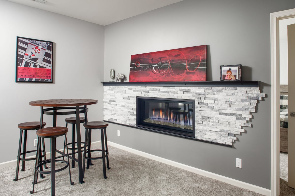 basement-fireplace-with-stone-surround-and-bar-table-council-bluffs-ia-optimized