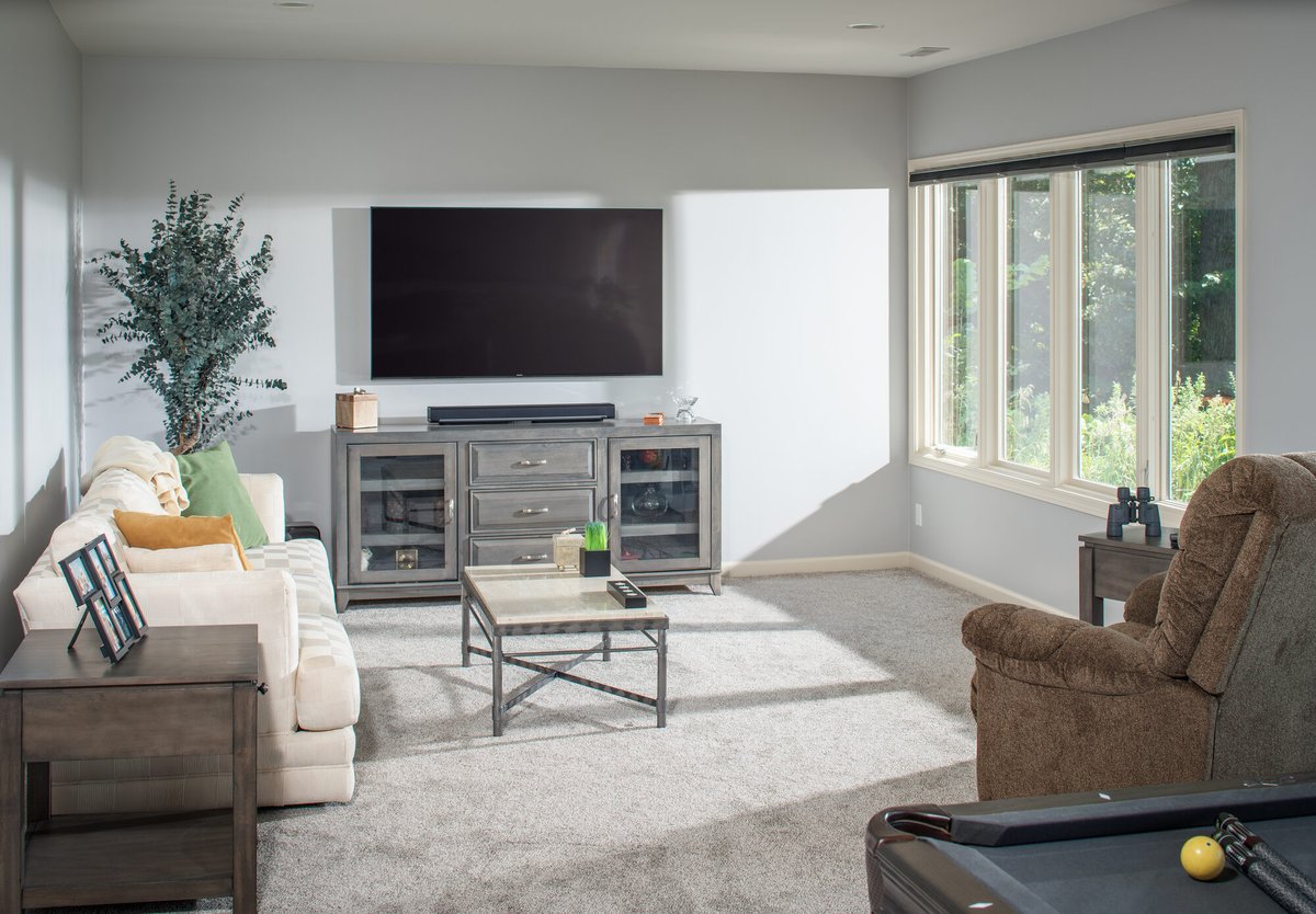 basement-living-area-with-tv-console-and-sofas-council-bluffs-ia-optimized