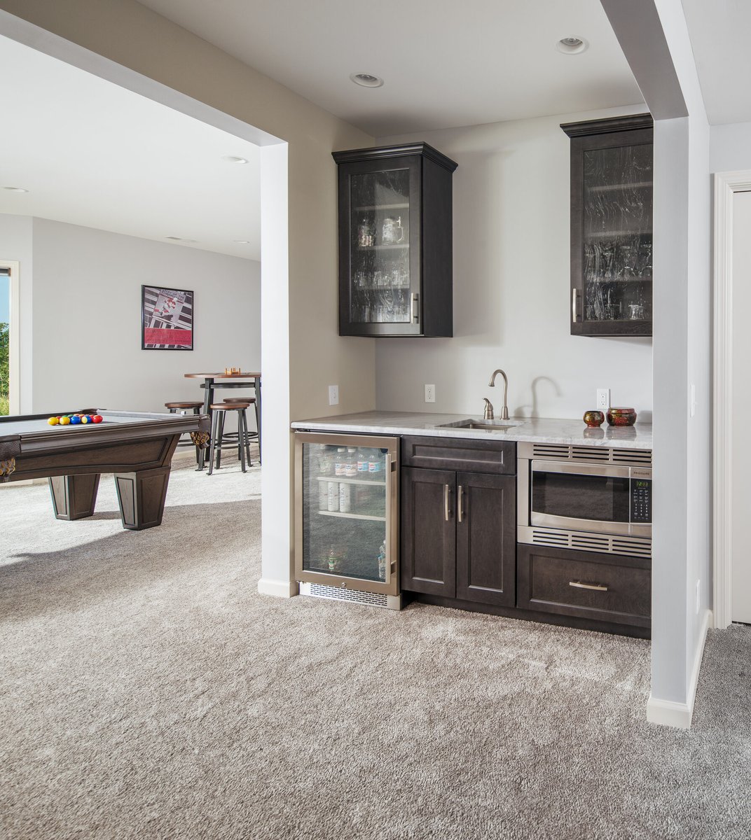basement-wet-bar-with-glass-cabinetry-council-bluffs-ia-optimized