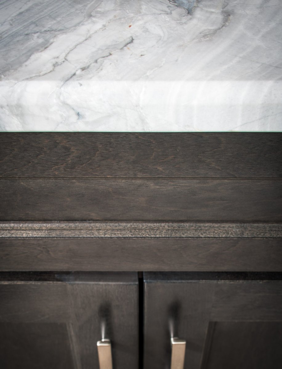 marble-countertop-and-dark-cabinetry-detail-council-bluffs-ia-optimized