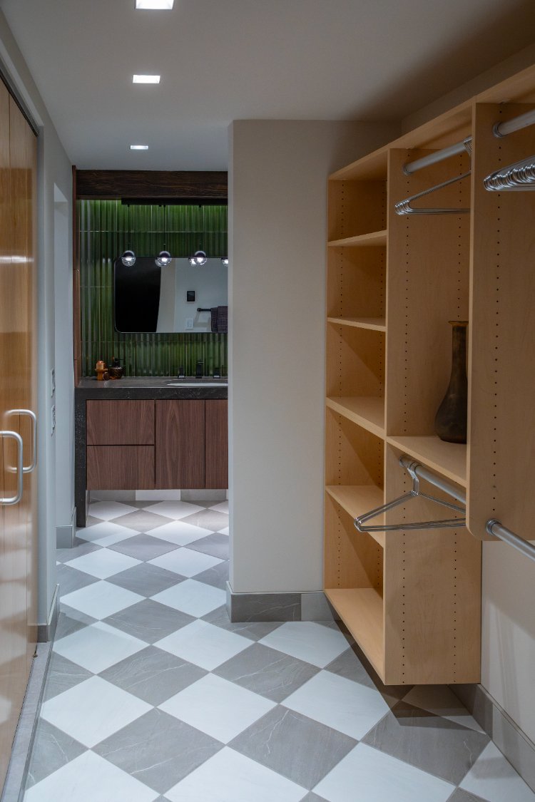 HC Remodel & Design modern Omaha, NE bathroom remodel featuring a custom walk-in closet, checkered tile flooring, walnut vanity,-optimized