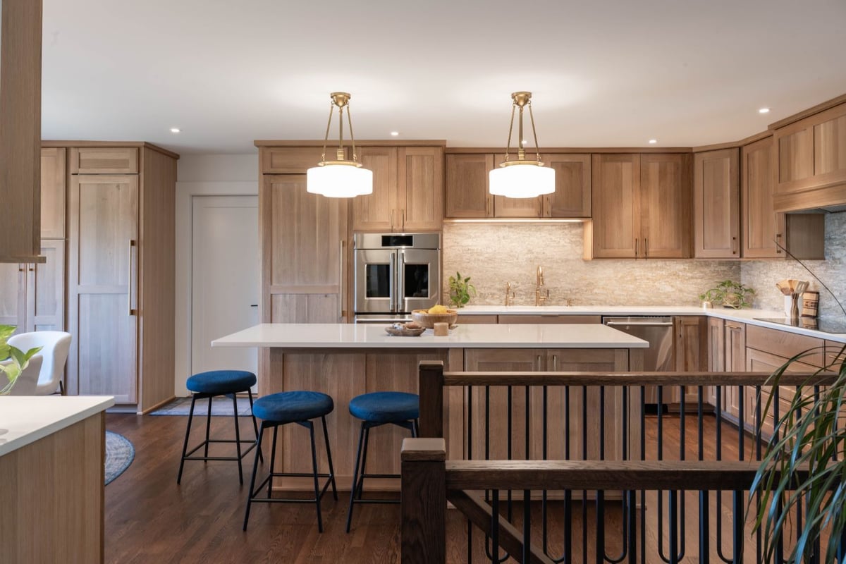 Bright open kitchen remodel by HC Remodel & Design with a large island and custom wood cabinetry in Council Bluffs, NE.-optimized