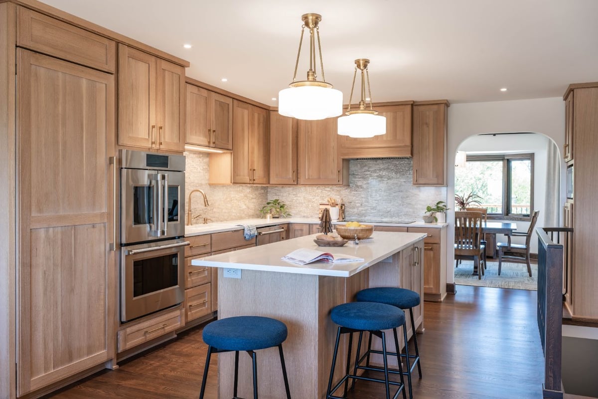 Contemporary kitchen remodel by HC Remodel & Design in Omaha, NE with a spacious island, custom cabinetry, and stainless steel a-optimized
