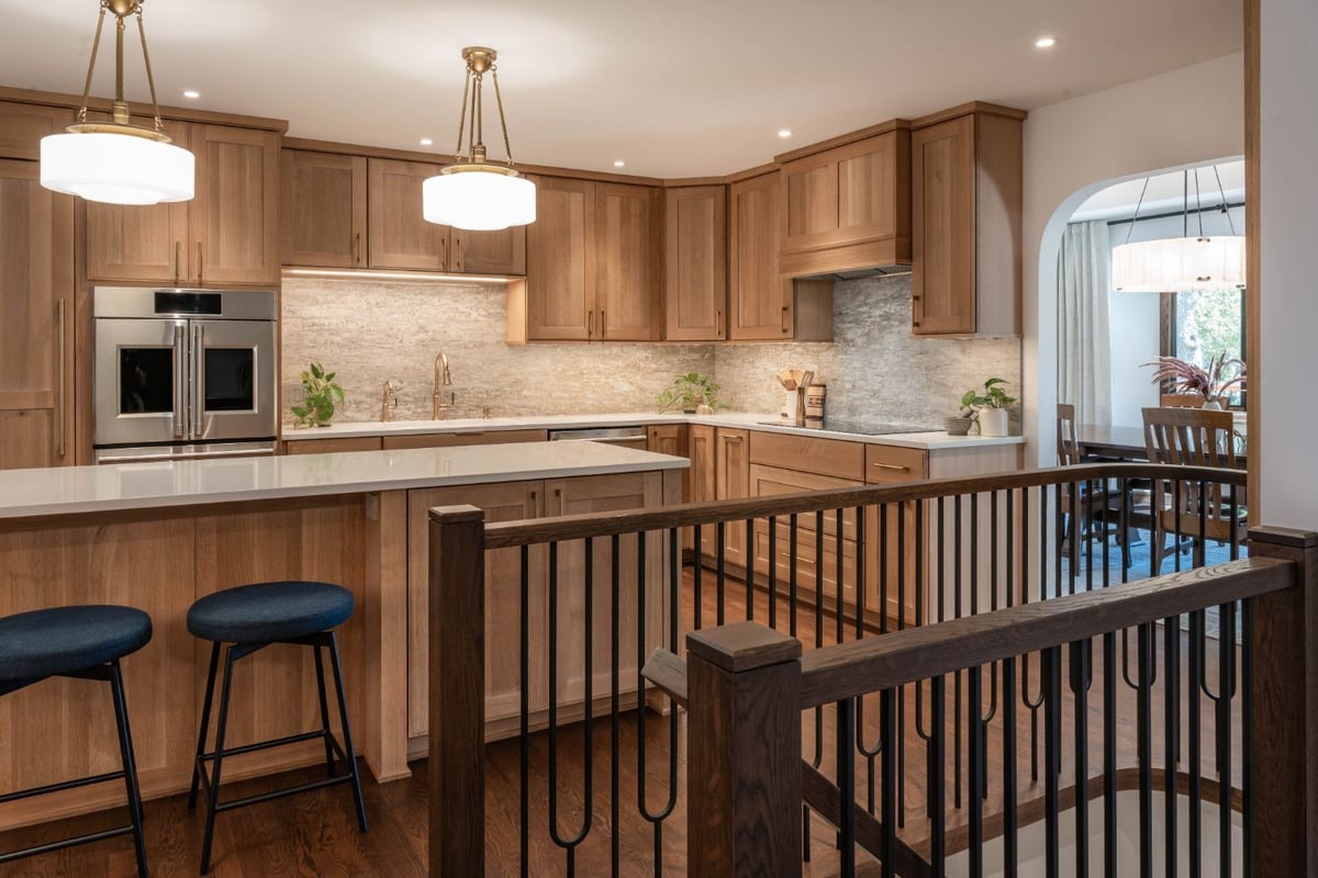 HC Remodel & Design kitchen remodel in Omaha, NE featuring custom cabinetry, quartz countertops, and an oversized island beside -optimized