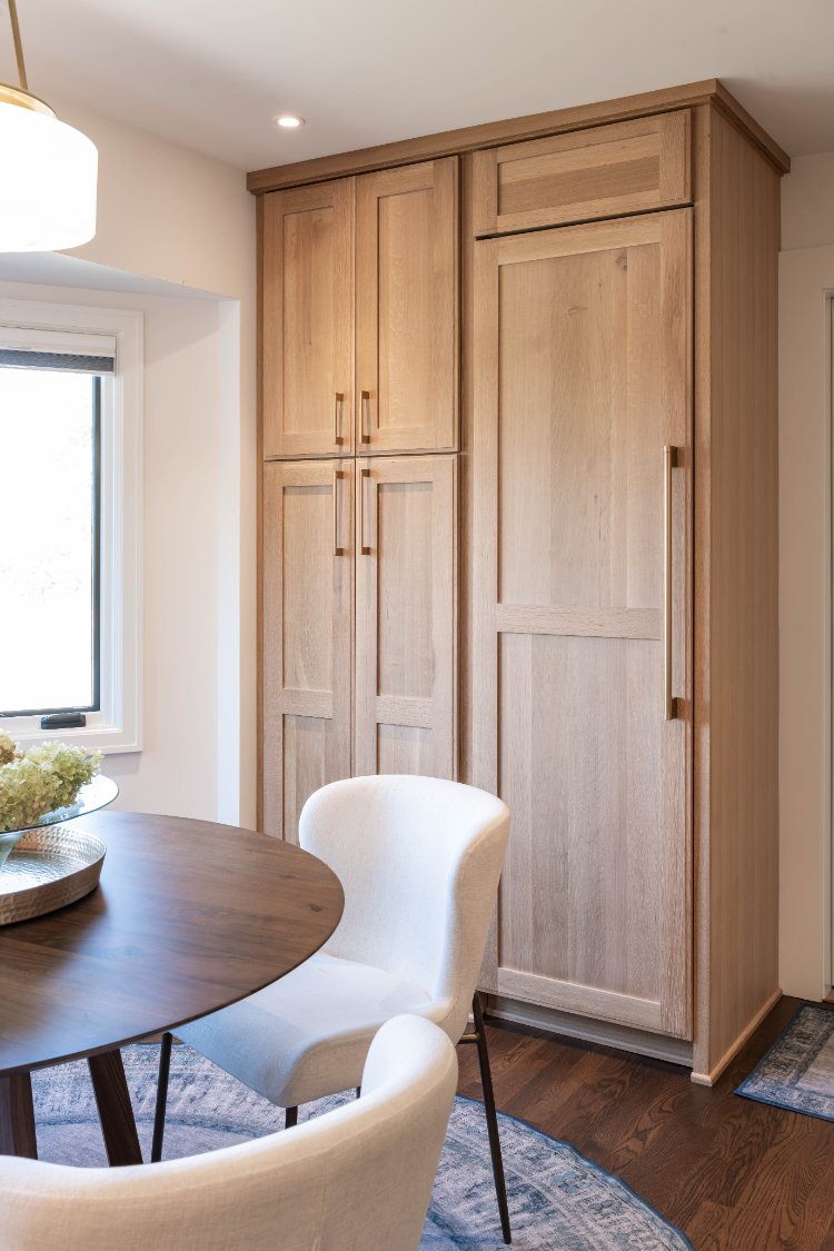 Tall pantry storage with custom wood cabinetry by HC Remodel & Design in a remodeled Council Bluffs kitchen.-optimized