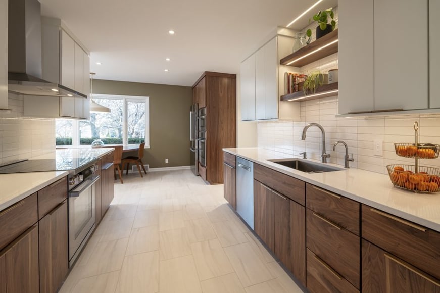 Modern galley kitchen renovation by HC Remodel & Design in Omaha, NE with custom cabinetry, open shelving, and stainless steel a-optimized