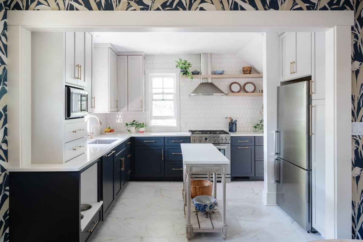 Bright kitchen remodel by HC Remodel & Design in Omaha, NE featuring blue and white shaker cabinetry, a custom island, open shel-optimized