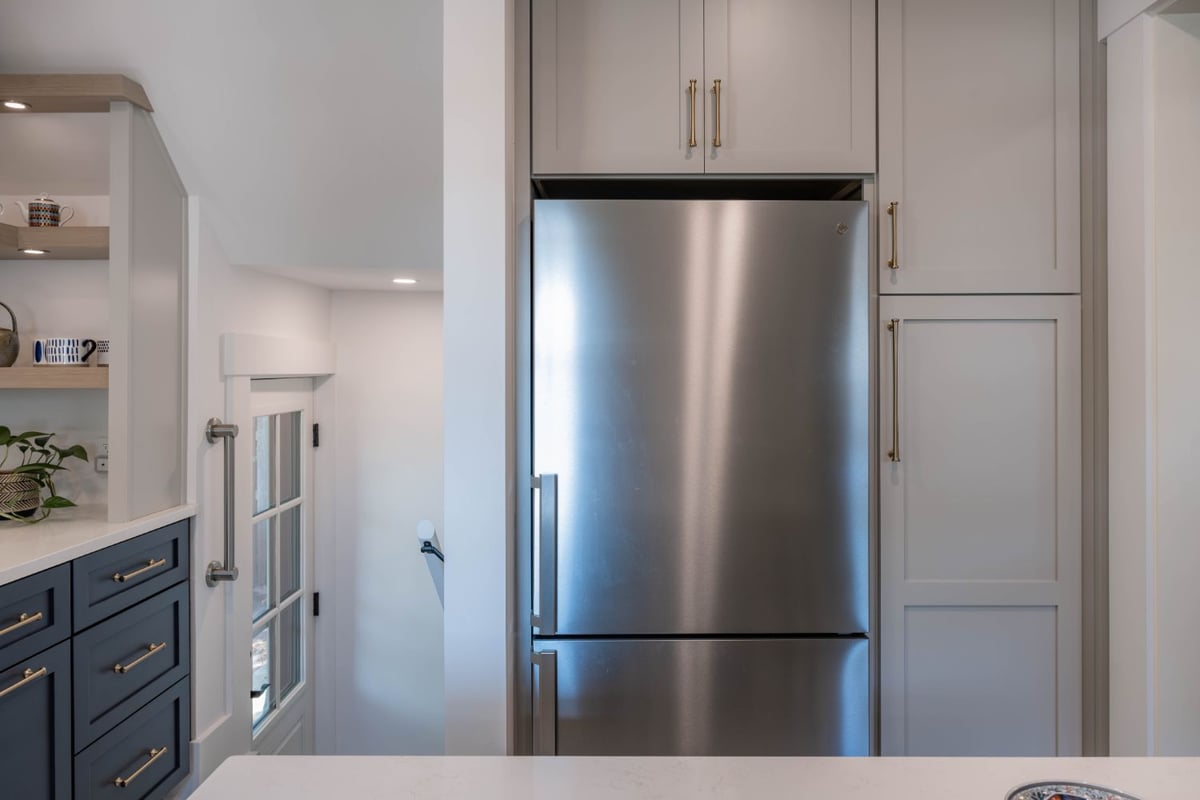 HC Remodel & Design kitchen remodel in Omaha, NE featuring integrated refrigerator cabinetry with custom storage.-optimized