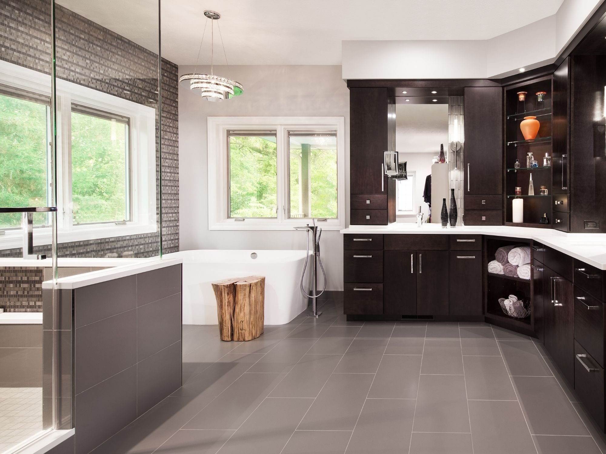 Luxury bathroom with dark wood cabinetry, soaking tub, and glass shower in Omaha & Council Bluffs.