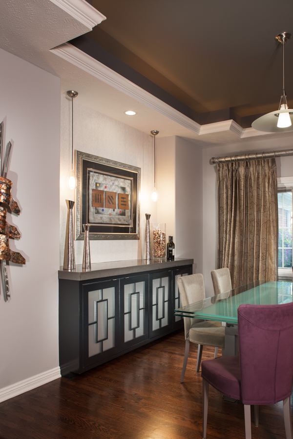 Custom dining room remodel by HC Remodel & Design in Omaha, NE featuring a contemporary buffet cabinet, tray ceiling, and modern-optimized