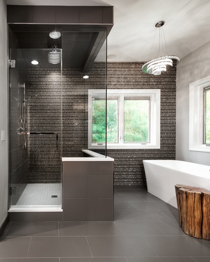 Modern walk-in shower and freestanding bathtub in a primary bathroom remodel by HC Remodel & Design in Omaha, NE.-optimized