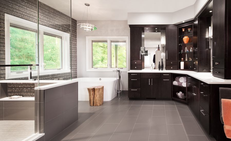 Spa-inspired primary bathroom remodel by HC Remodel & Design in Omaha, NE with a freestanding tub, glass shower, and custom vani-optimized