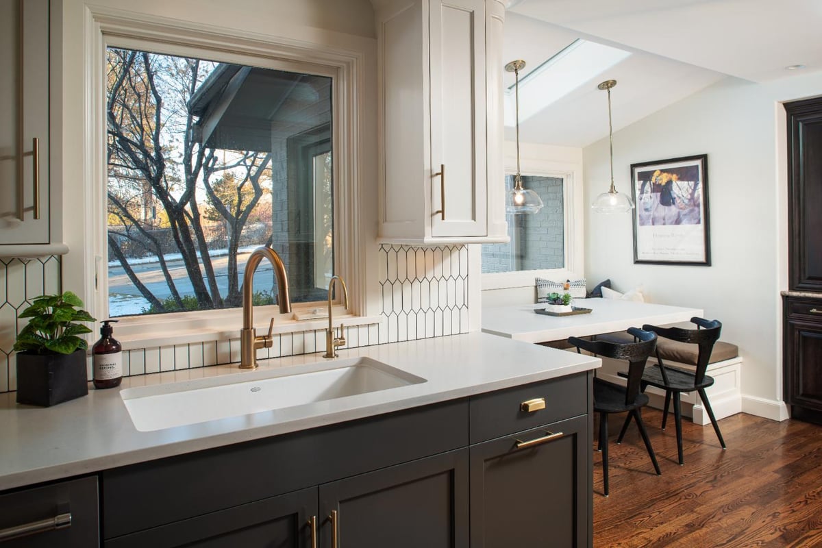 HC Remodel & Design kitchen remodel in Omaha, NE featuring a custom sink, quartz countertops, and a built-in breakfast nook.-optimized