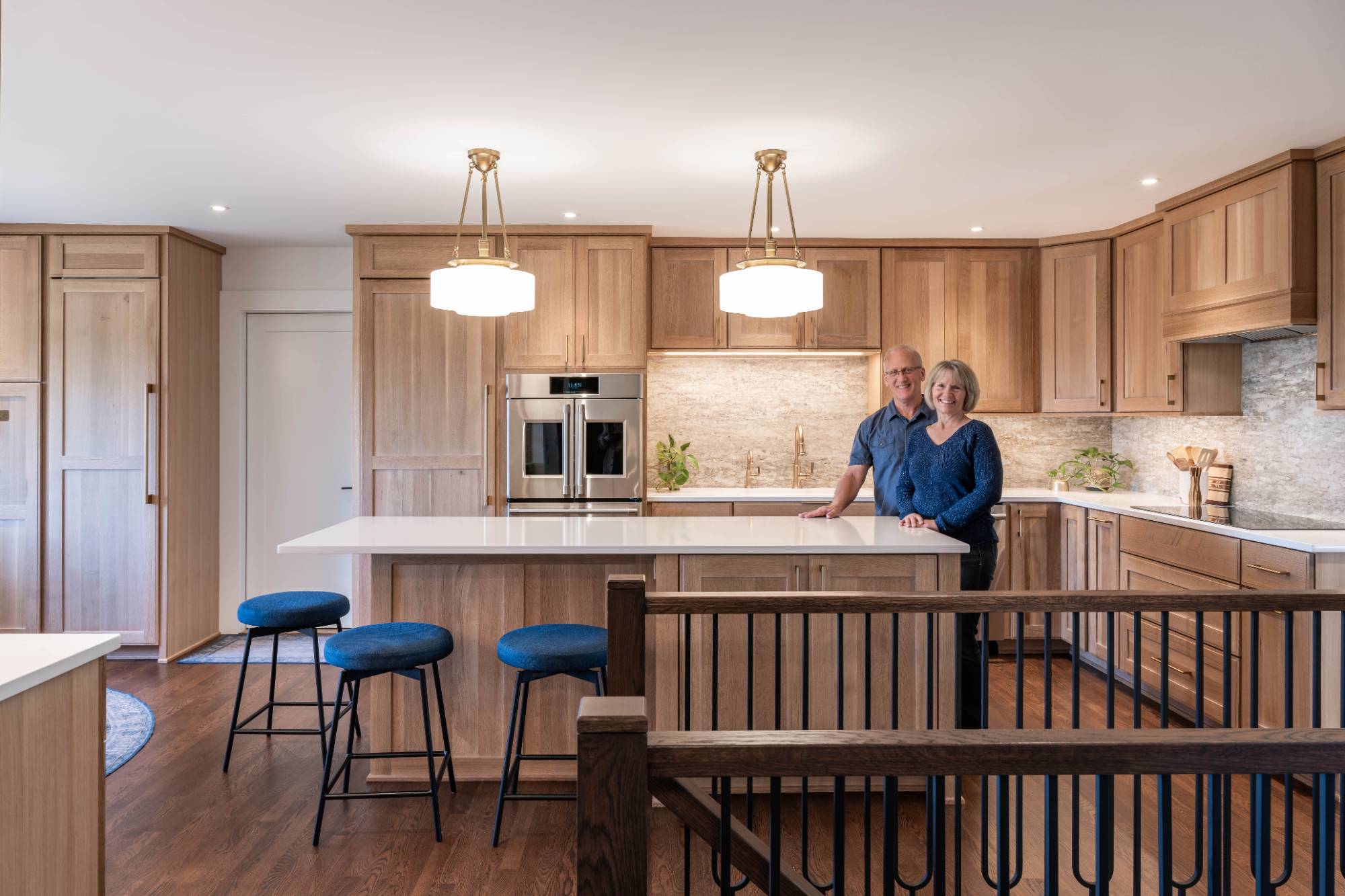 Homeowners standing in their newly remodeled kitchen by HC Remodel & Design in Council Bluffs, NE.-optimized