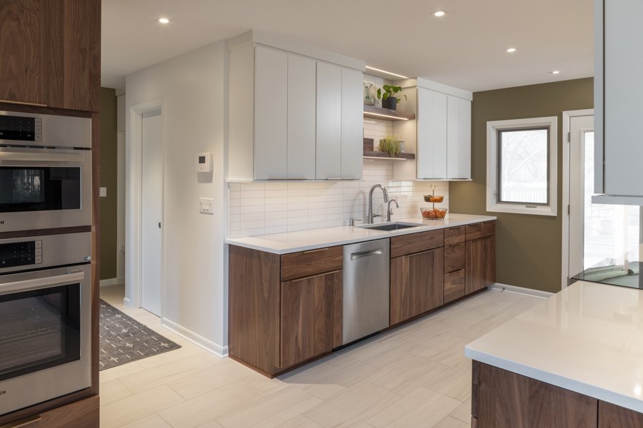 Modern kitchen renovation by HC Remodel & Design in Omaha, NE with quartz countertops, custom cabinetry, and decorative open she-optimized
