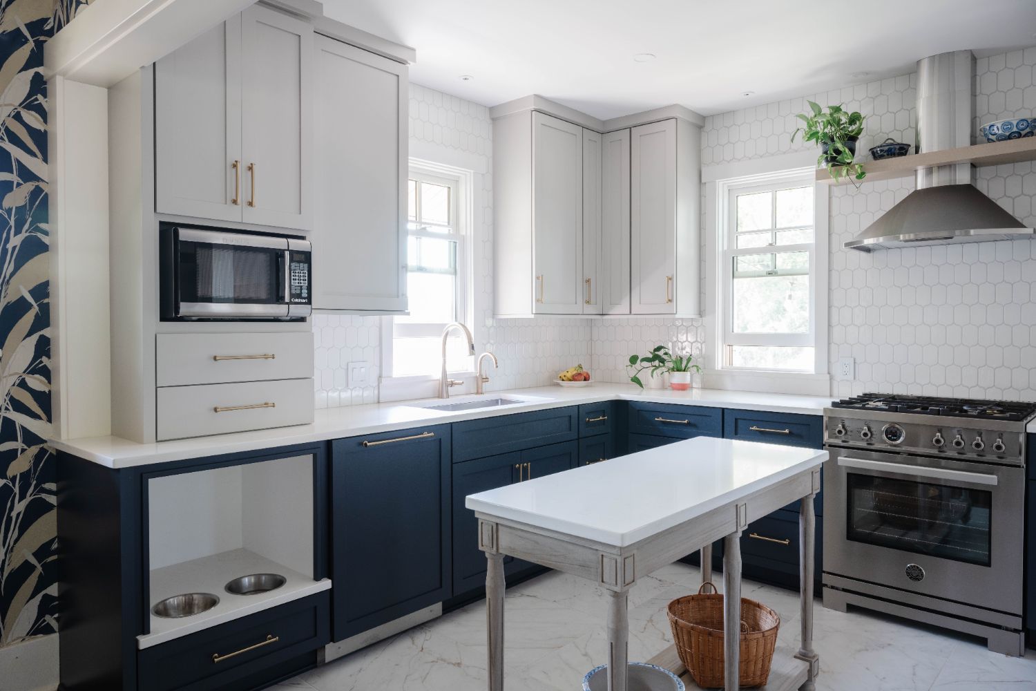 Kitchen remodel by HC Remodel & Design in Omaha, NE featuring navy shaker cabinets, white countertops, and a custom prep island.-optimized