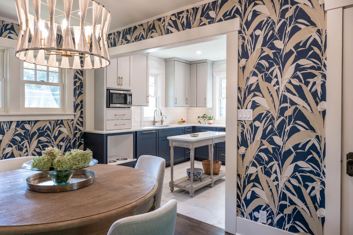 Kitchen remodel by HC Remodel & Design in Omaha, NE viewed from the dining room with blue cabinetry, custom island, and decorati-optimized