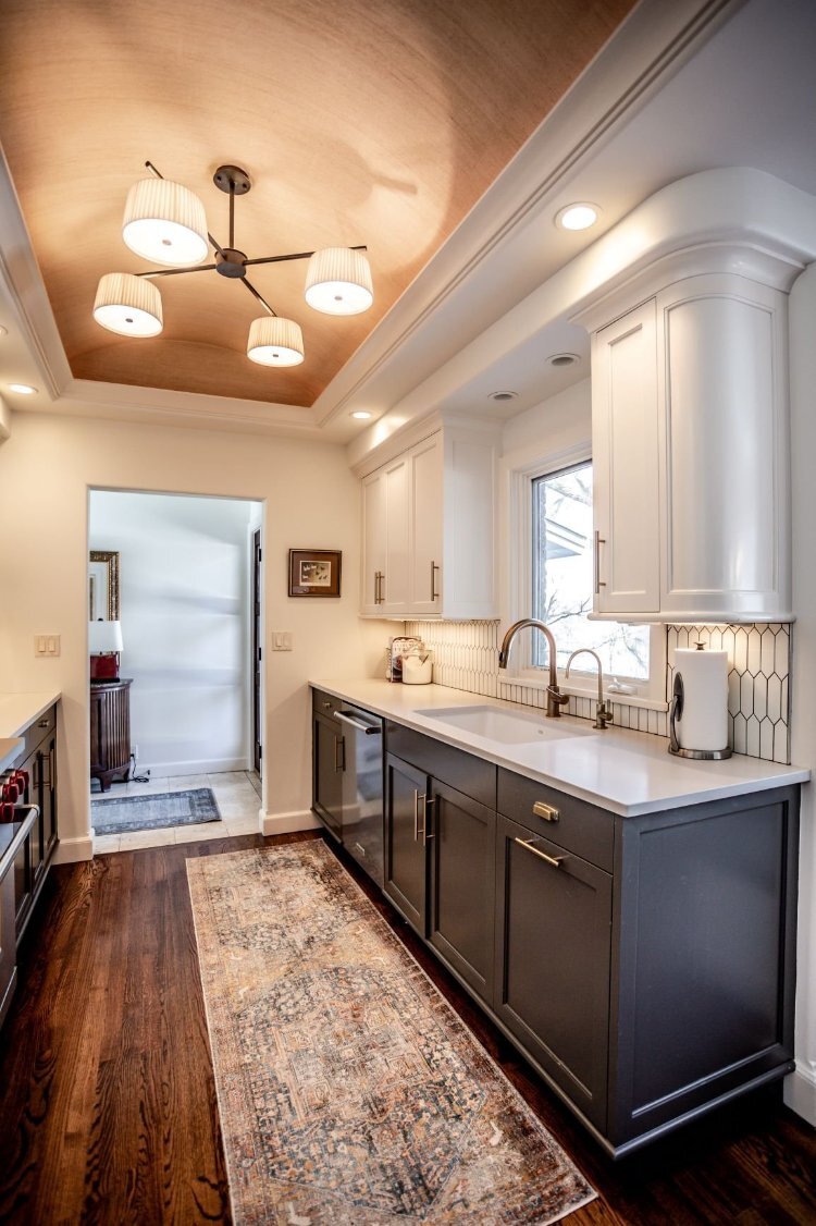 Bright Omaha, NE kitchen renovation by HC Remodel & Design with gray lower cabinets, white uppers, and decorative ceiling detail-optimized