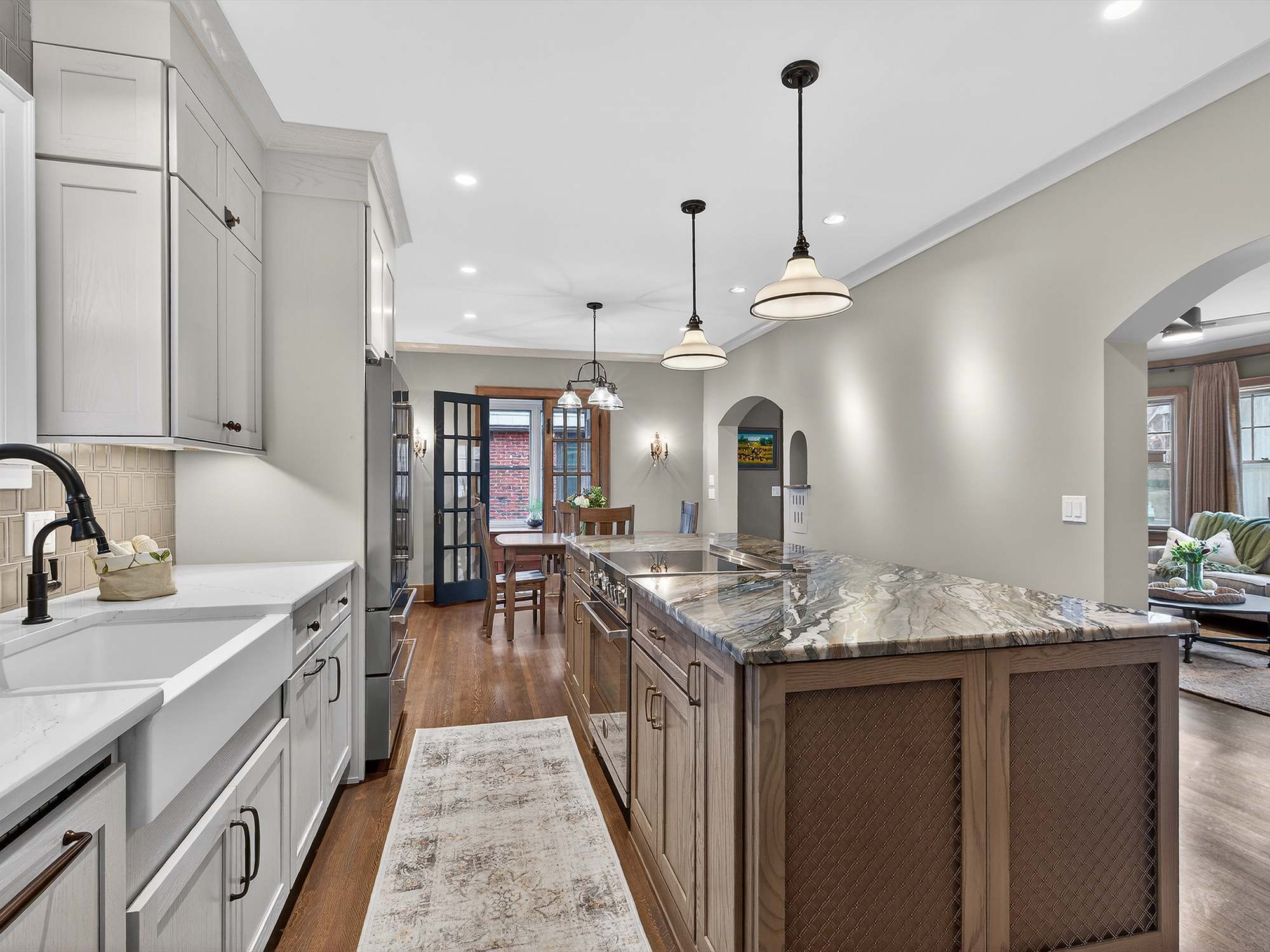 open-concept-kitchen-farmhouse-sink-marble-island