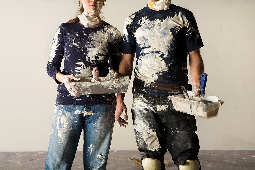 Image of two people covered in paint